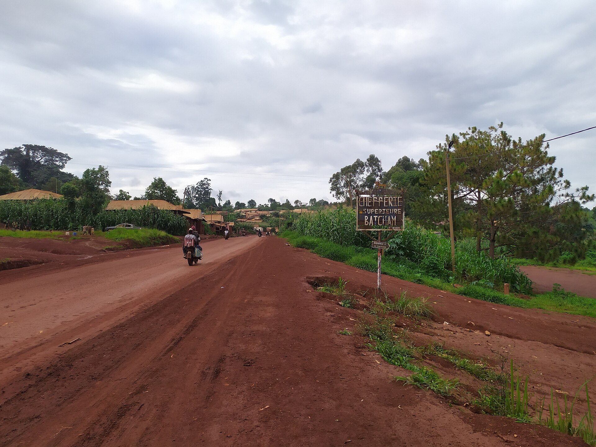 Red earth road leading to the chieftaincy through the highlands
